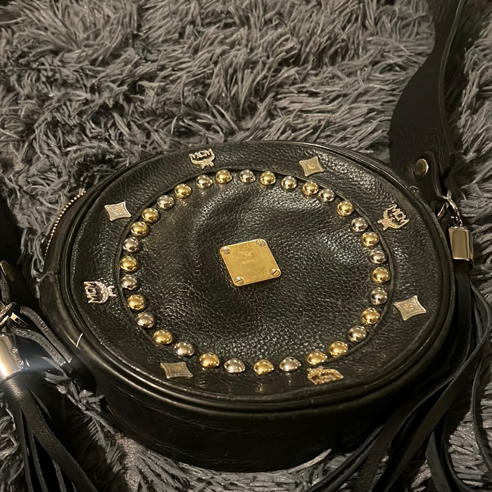 Black and gold AUTHENTIC MCM ha the straps custom made over and tassels to